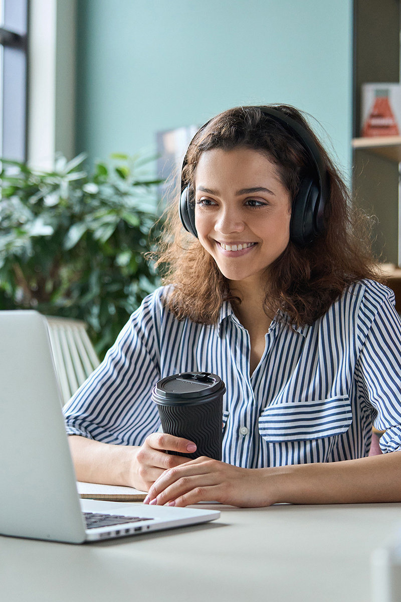 Woman on laptop attending virtual event